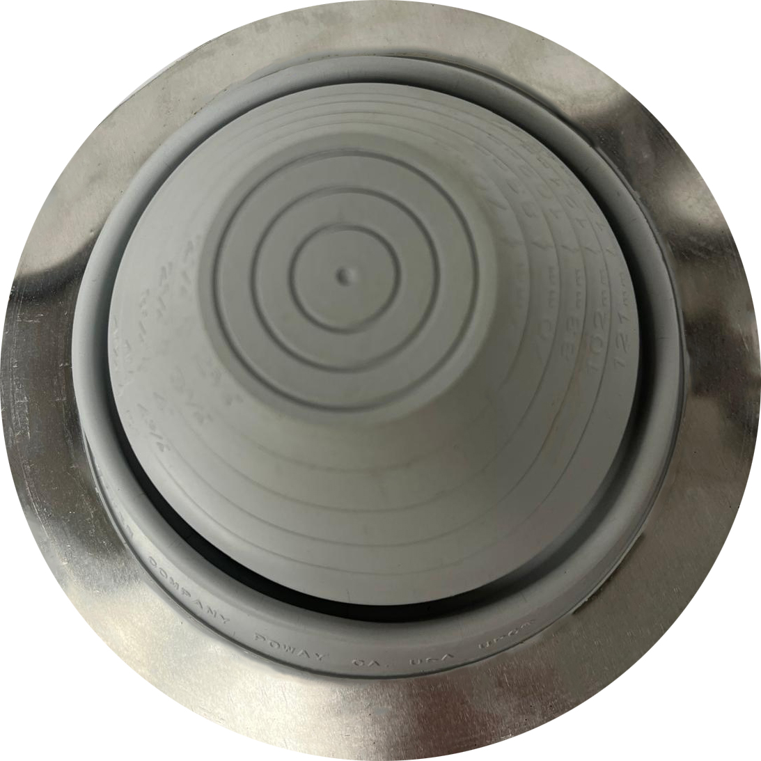 Top view of the light grey pipe flashing for Worthouse metl roofing